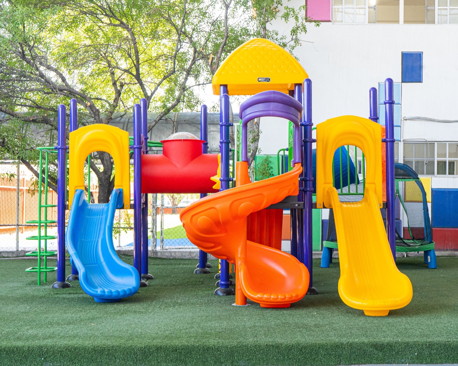 Custom playground equipment designed for a compact irregular courtyard site