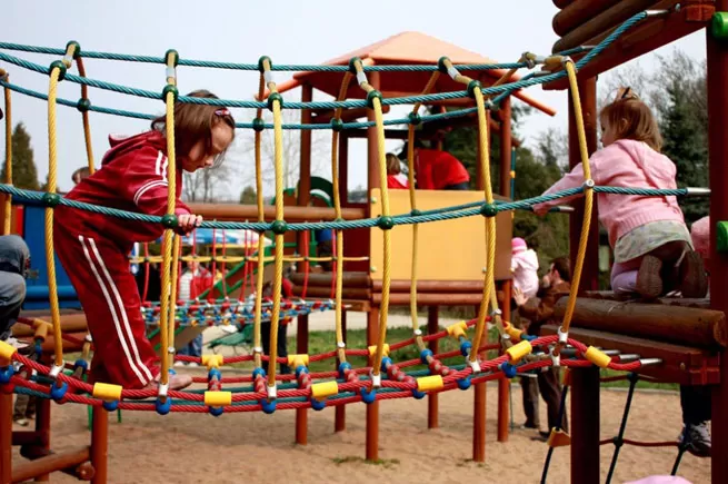 wooden climbing frame with slide